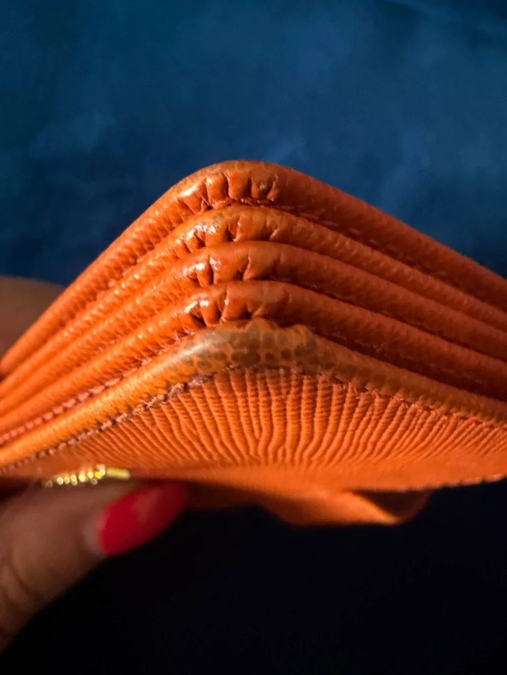 Orange Prada Saffiano Leather accordion card holder.
